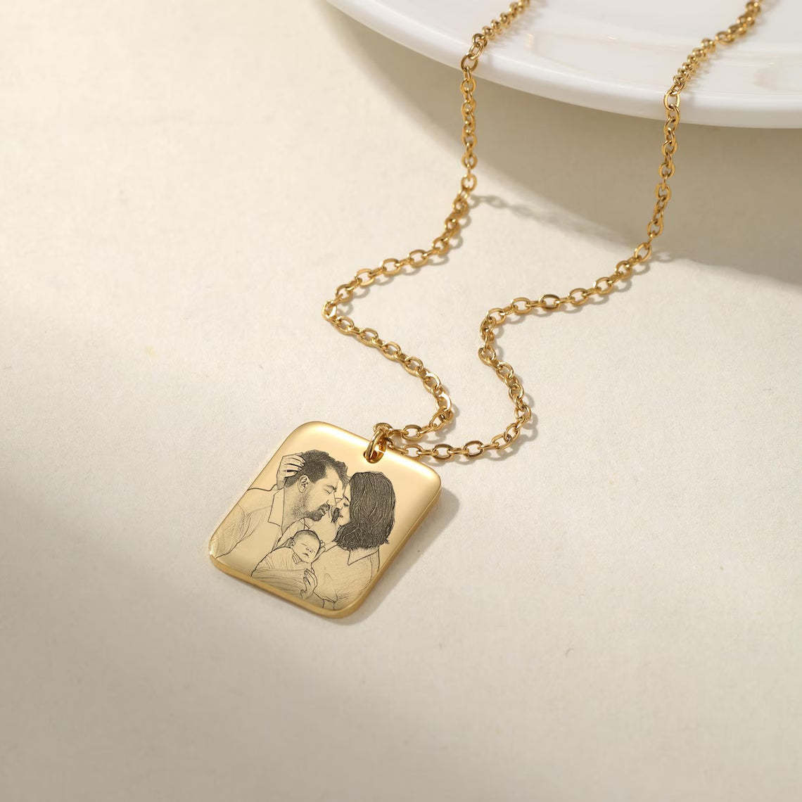 Wear Your Family Close to Your Heart - Custom Engraved Gold Family Portrait Necklace. #FamilyPortraitNecklace #GoldEngravedJewelry #CustomFamilyGift