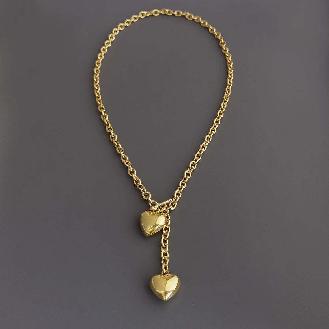 Elevate Your Style with a Gold-Tone Heart Pendant Necklace - A Symbol of Love and Elegance. #GoldHeartNecklace #PendantNecklace #LoveJewelry