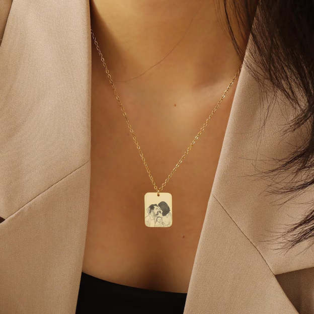 Wear Your Family Close to Your Heart - Custom Engraved Gold Family Portrait Necklace. #FamilyPortraitNecklace #GoldEngravedJewelry #CustomFamilyGift