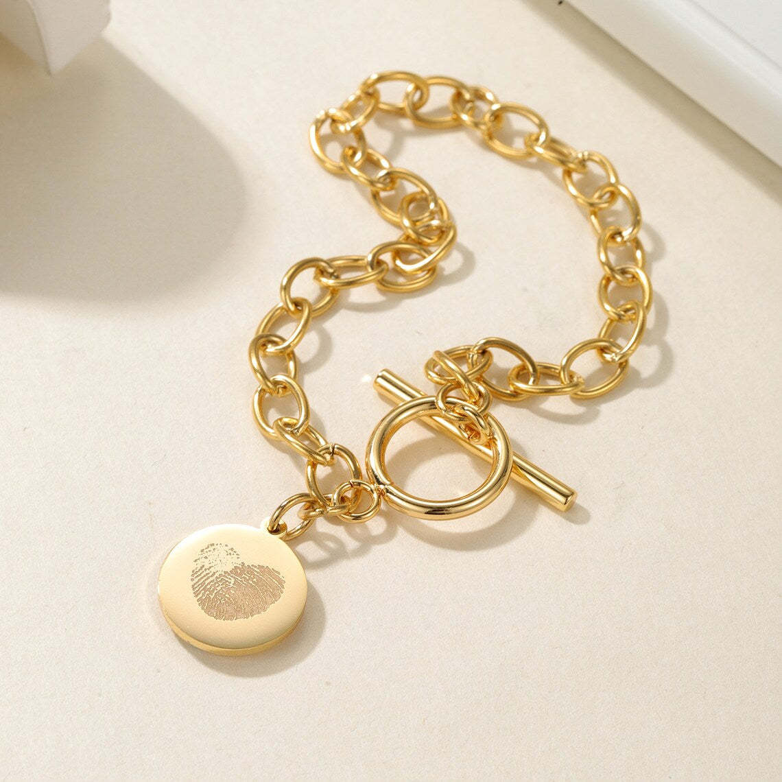 Cherish Life's Moments - Gold-Tone Fingerprint Bracelet, a Personal Touch. #FingerprintBracelet #GoldJewelry #PersonalizedGift