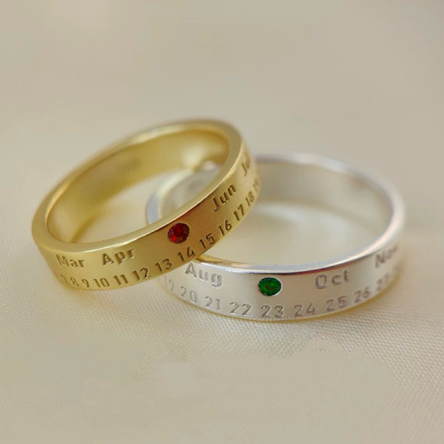 Silver anniversary rings with birthstone markings