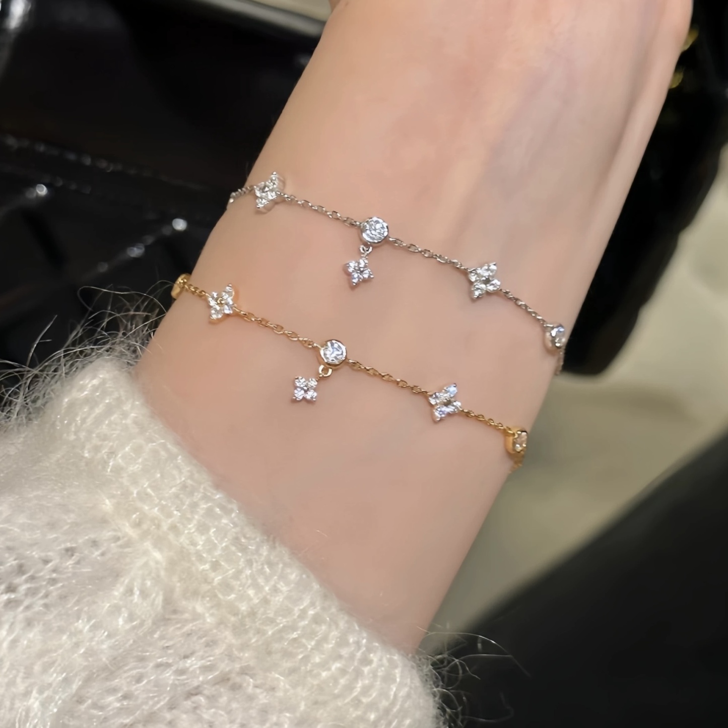 Gold and silver bracelet with clover charms