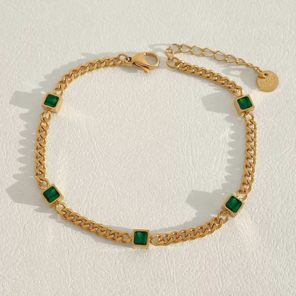 Gold-plated bracelet, emerald gemstones, women's jewelry, fashion accessory, luxury bracelet