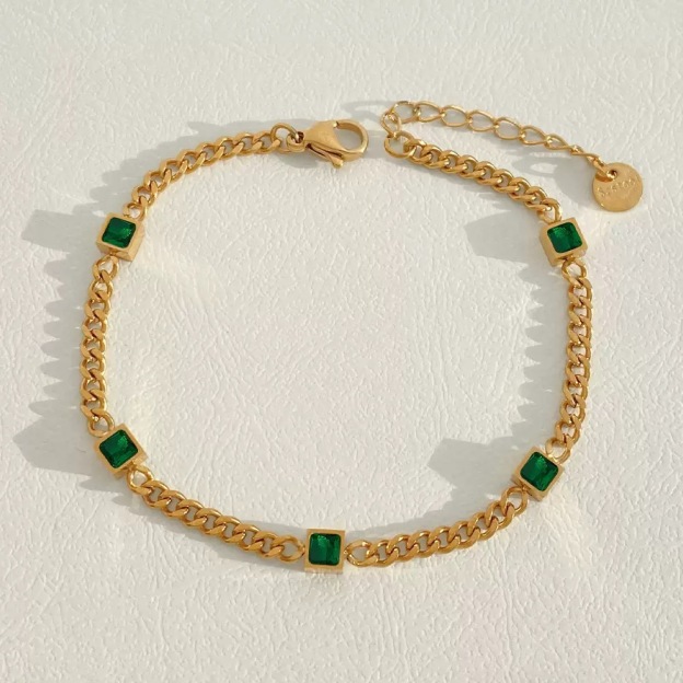Gold-plated bracelet, emerald gemstones, women's jewelry, fashion accessory, luxury bracelet