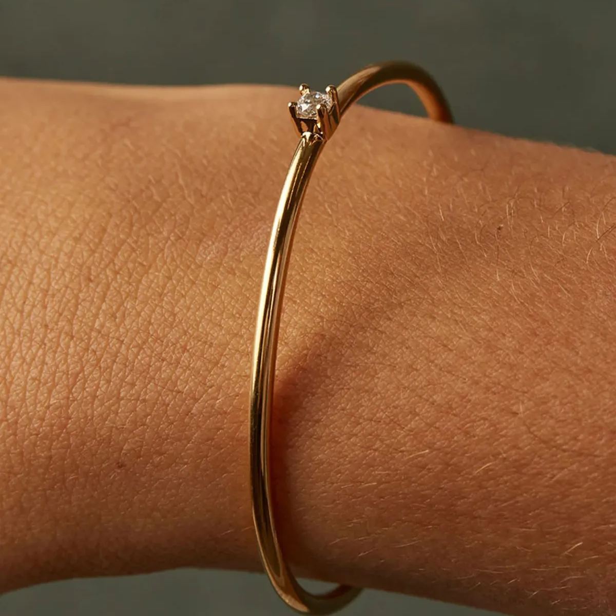 Gold-plated open solitaire bangle bracelet