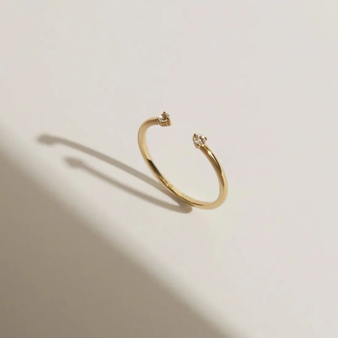 Gold-plated open end ring with two gemstones
