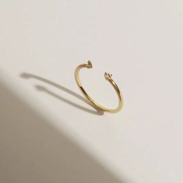 Gold-plated open end ring with two gemstones
