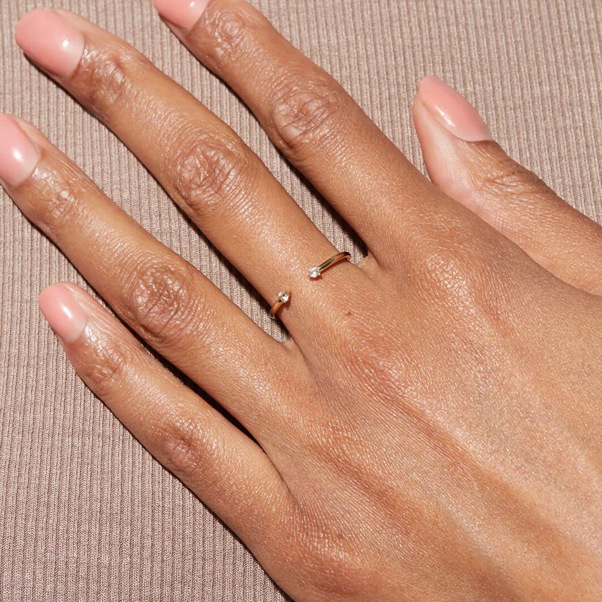 Gold-plated open end ring with two gemstones