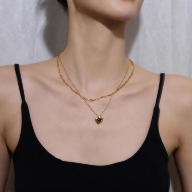 Gold-tone necklace with black heart pendant