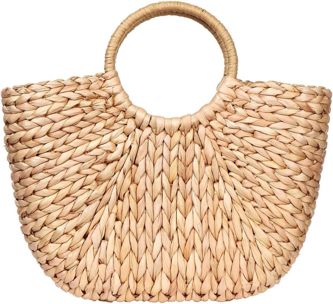 Handwoven summer rattan tote bag with top handle, displayed against a neutral background.

