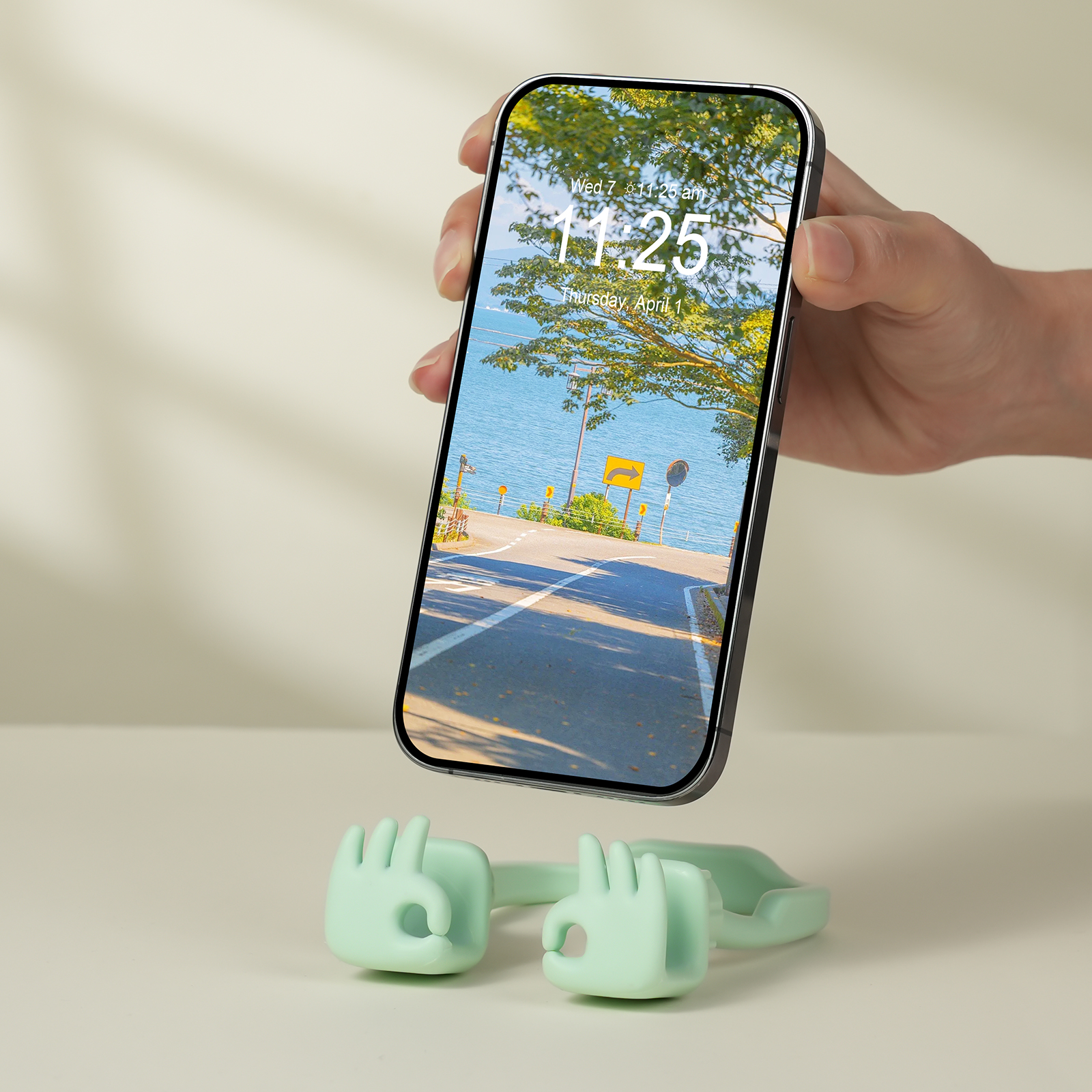 {"default":"Mint green Everything's OK expressive phone stand holding a smartphone, a calm accessory for office or home use."}
