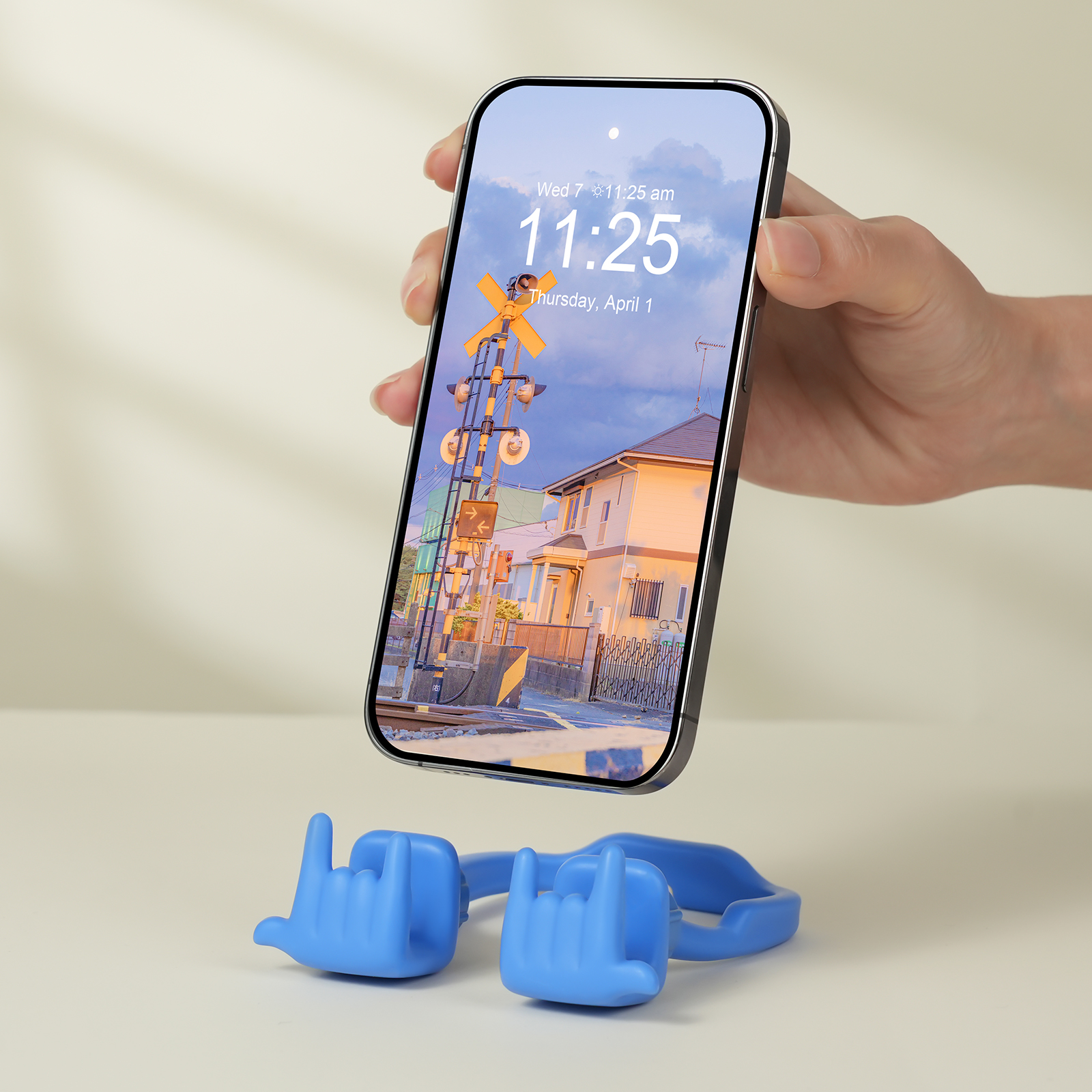 {"default":"blue Rock On expressive phone stand supporting a smartphone, showcasing its bold, high-energy, and music-inspired Vibe."}
