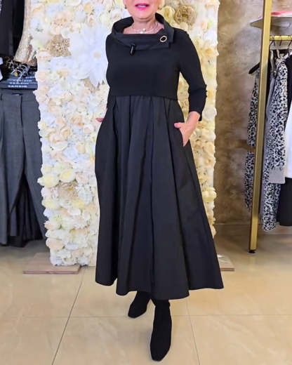 Abito lungo elegante e sofisticato con colletto alto e vita alta