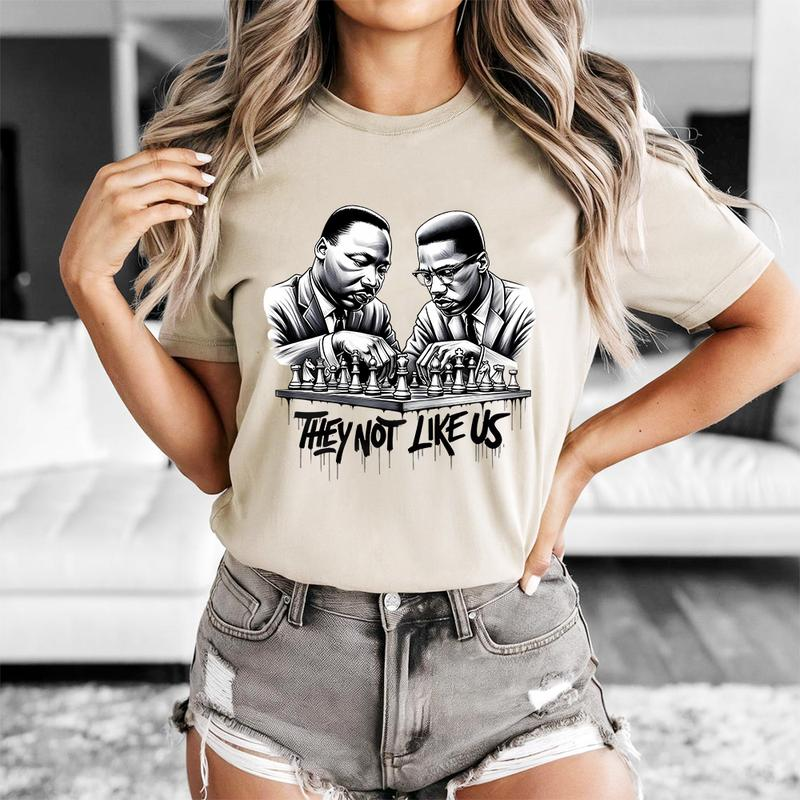 They Not Like Us T-Shirt-MLK & Malcolm X Chess Graphic Tee for Black History & Culture