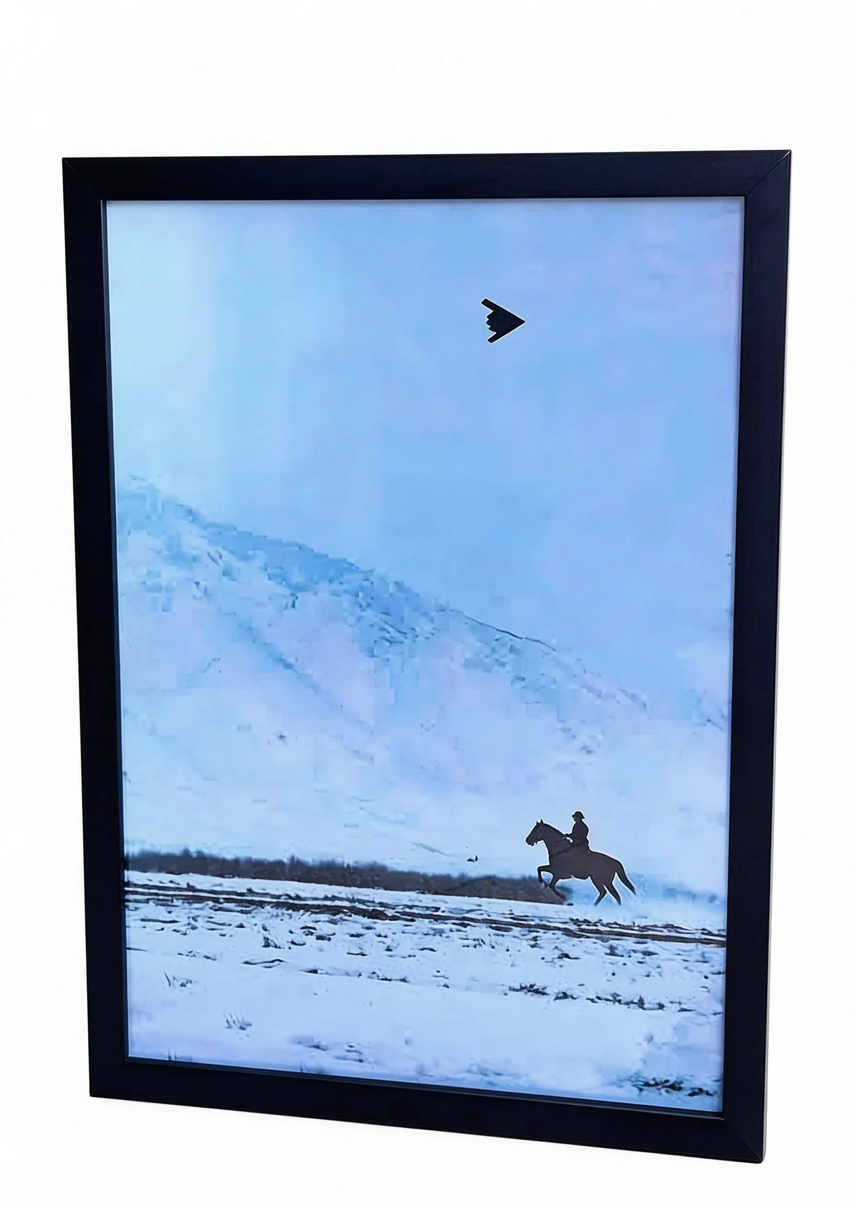 Artwork wall hanging featuring "B2 stealth bomber and cowboy on horseback".