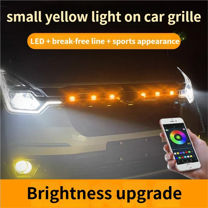 small yellow light on car grille