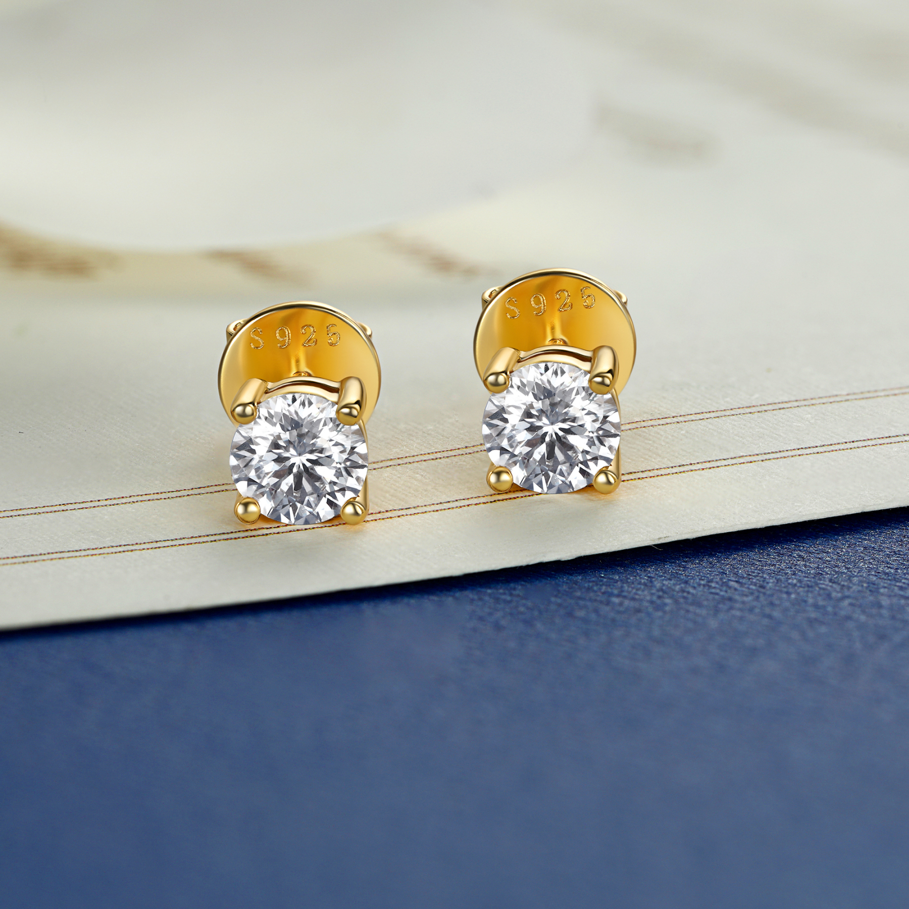 4 Prong Round Stud Moissanite Earrings in Yellow Gold (D Color VVS1)