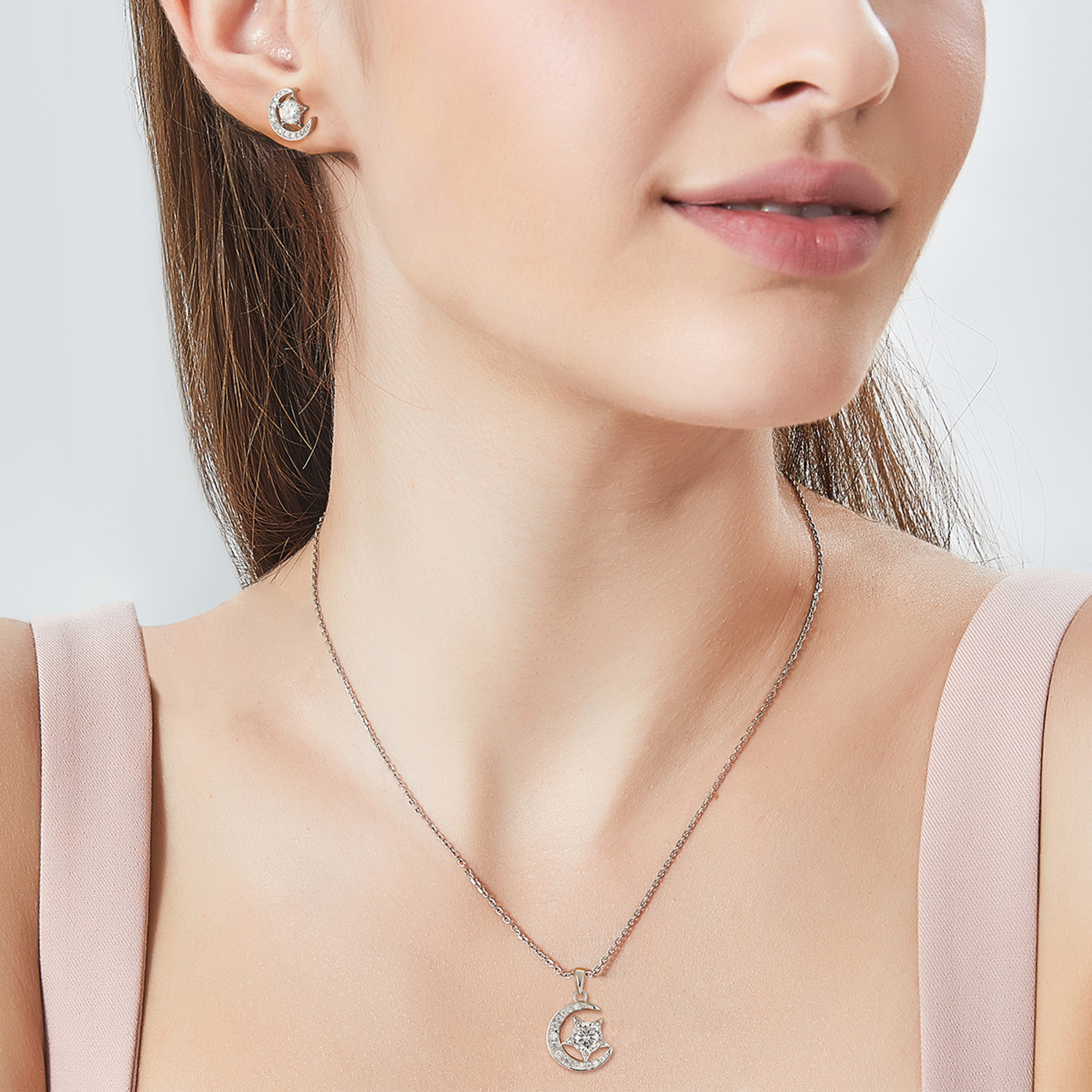 Moon & Star Stud Moissanite Earrings in White Gold (1/2 Ct. VVS1)