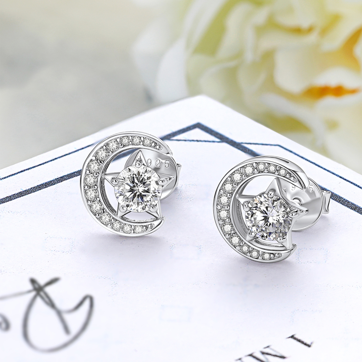 Moon & Star Stud Moissanite Earrings in White Gold (1/2 Ct. VVS1)