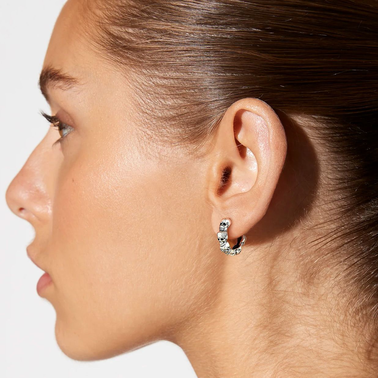 Three Wise Skull Hoop Earrings In 925 Sterling Silver - model effect