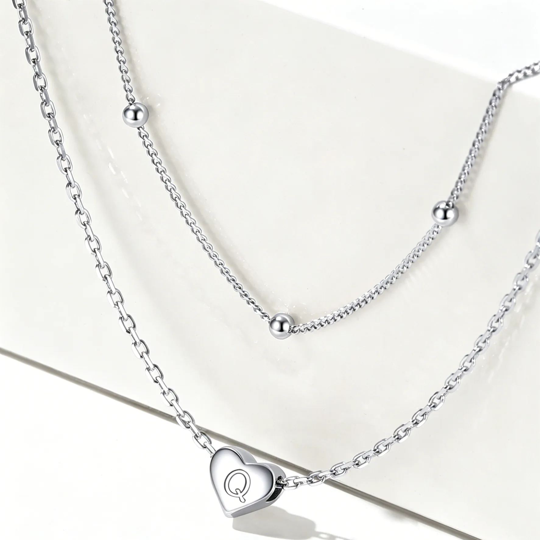 Double-layered initial heart necklace