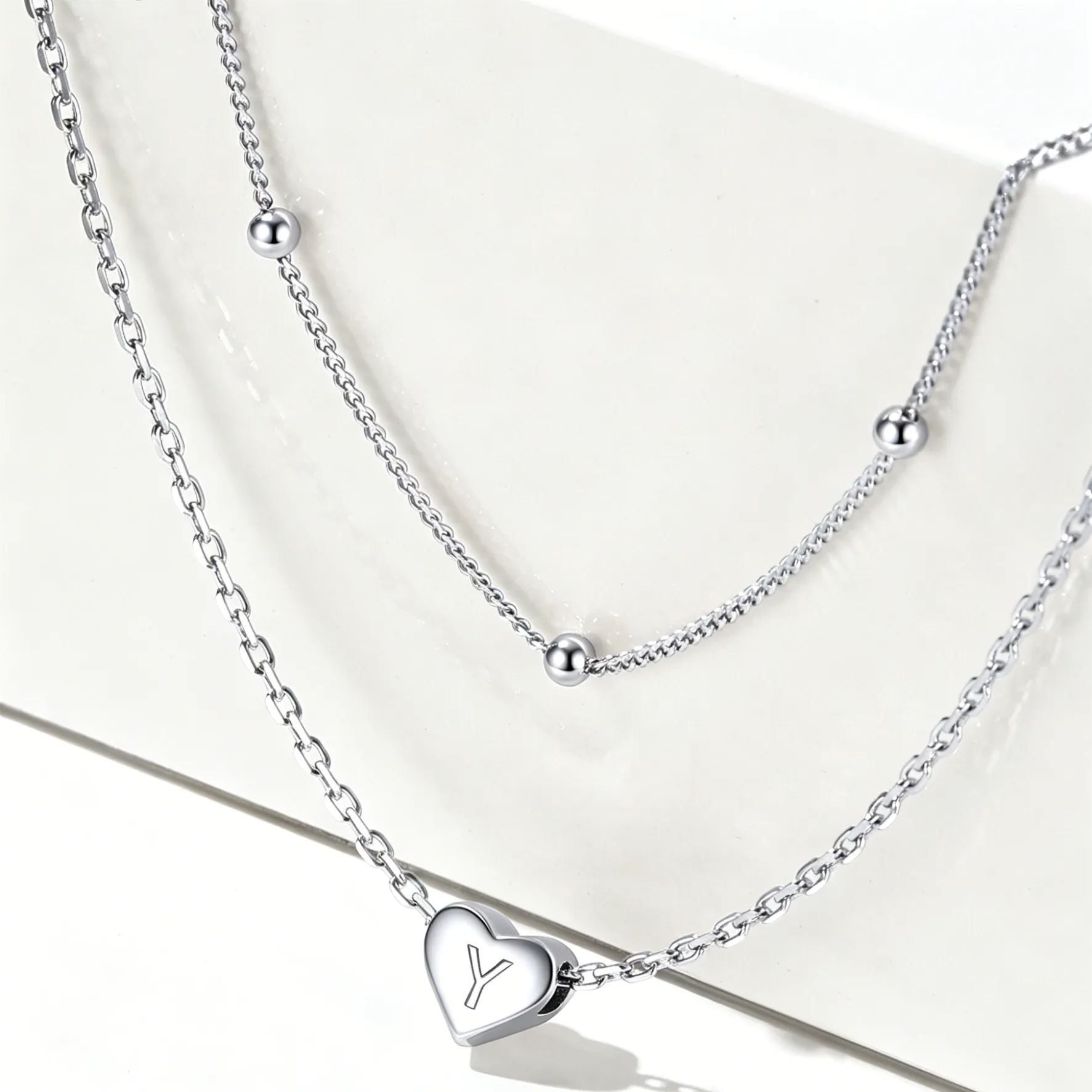 Double-layered initial heart necklace