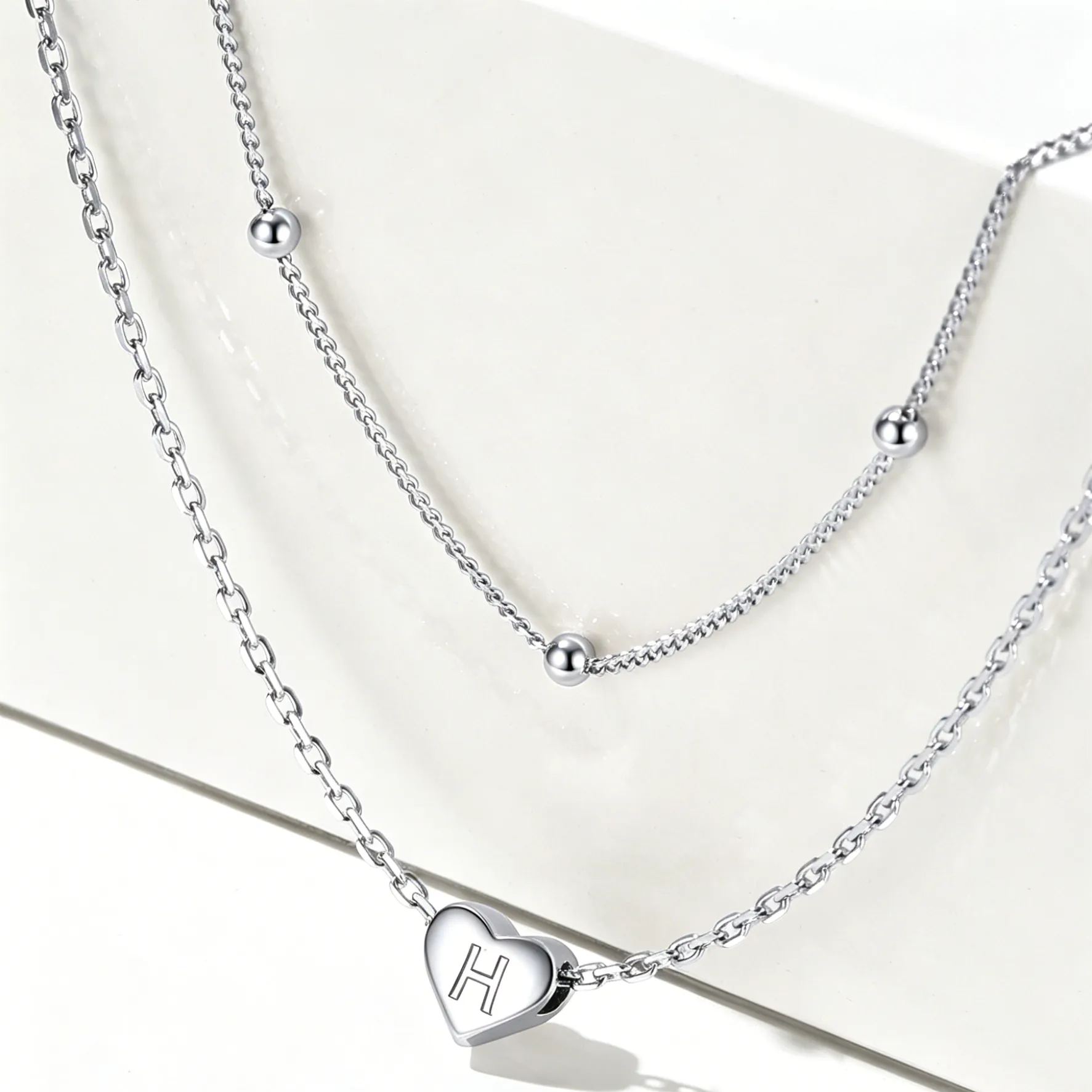 Double-layered initial heart necklace