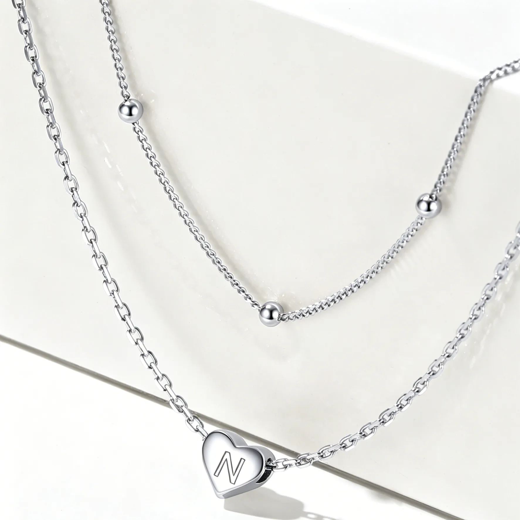 Double-layered initial heart necklace