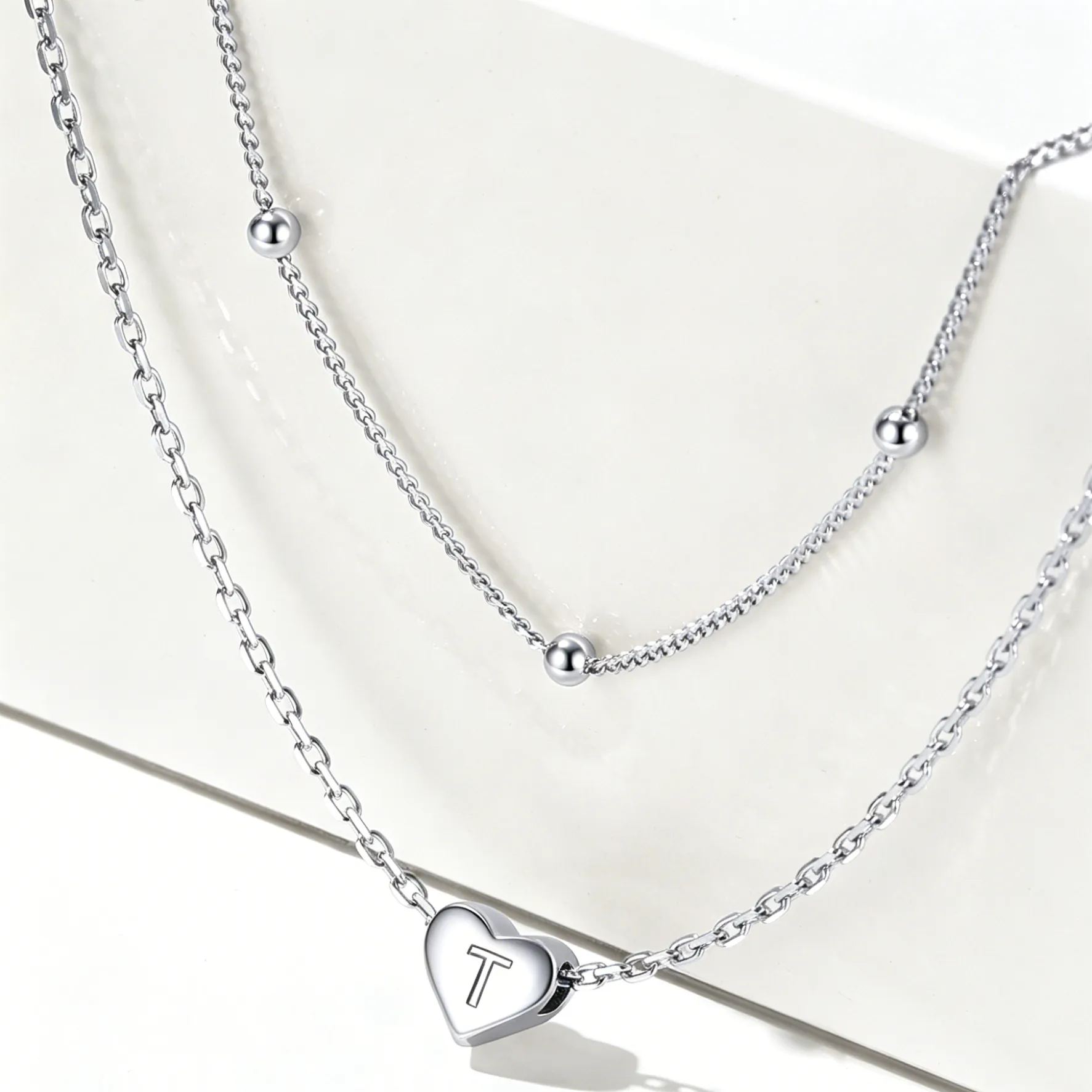Double-layered initial heart necklace