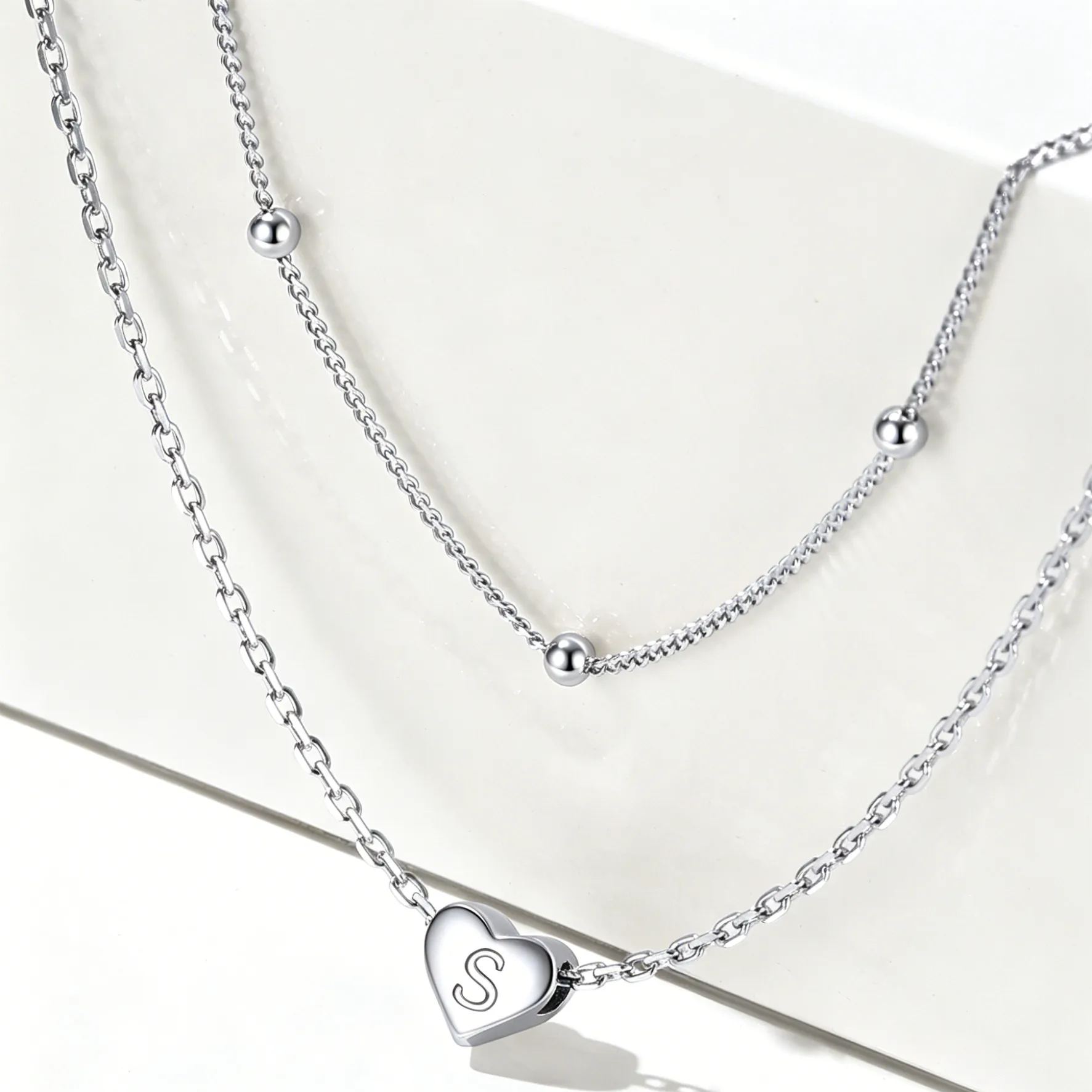 Double-layered initial heart necklace