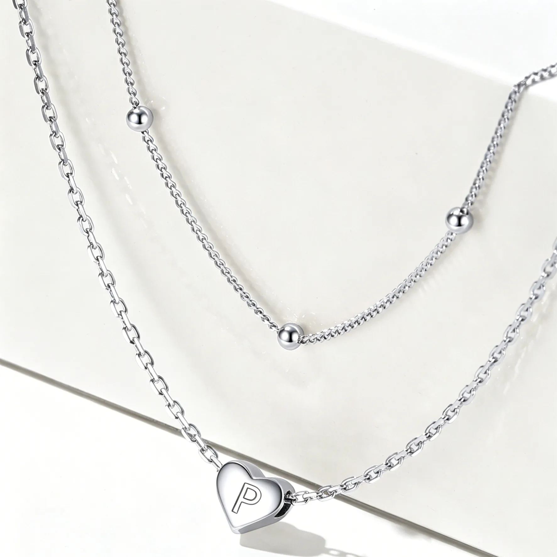 Double-layered initial heart necklace