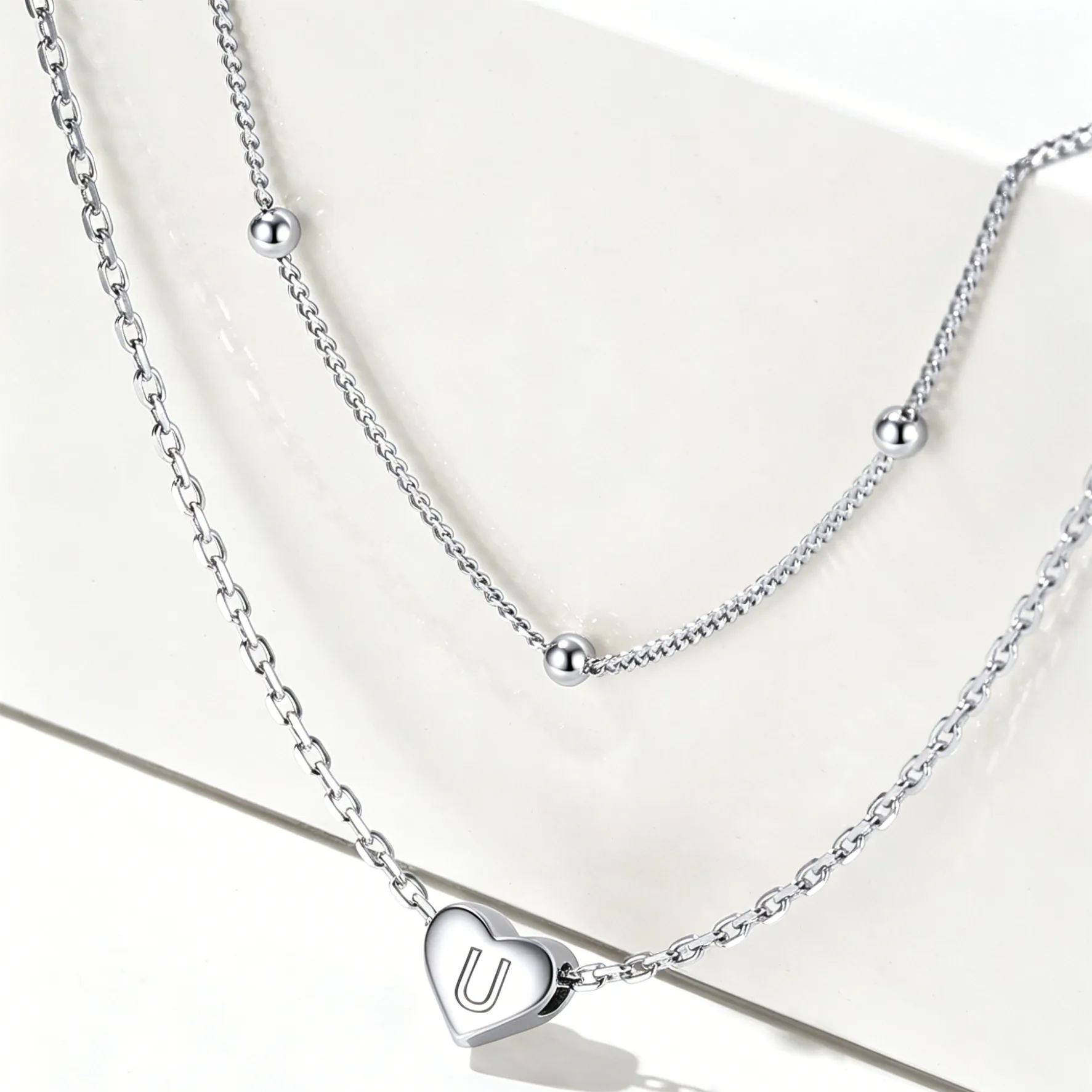 Double-layered initial heart necklace