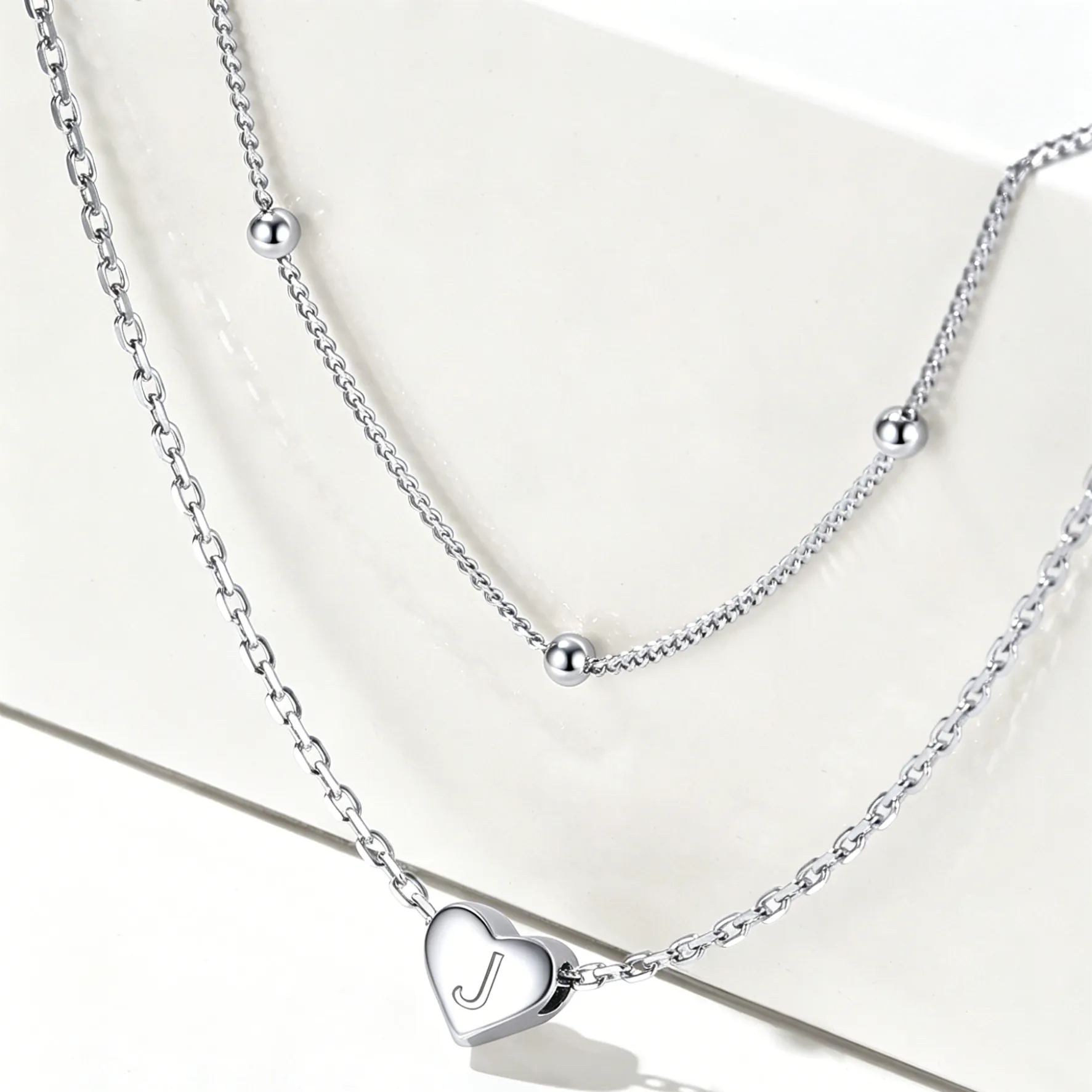 Double-layered initial heart necklace