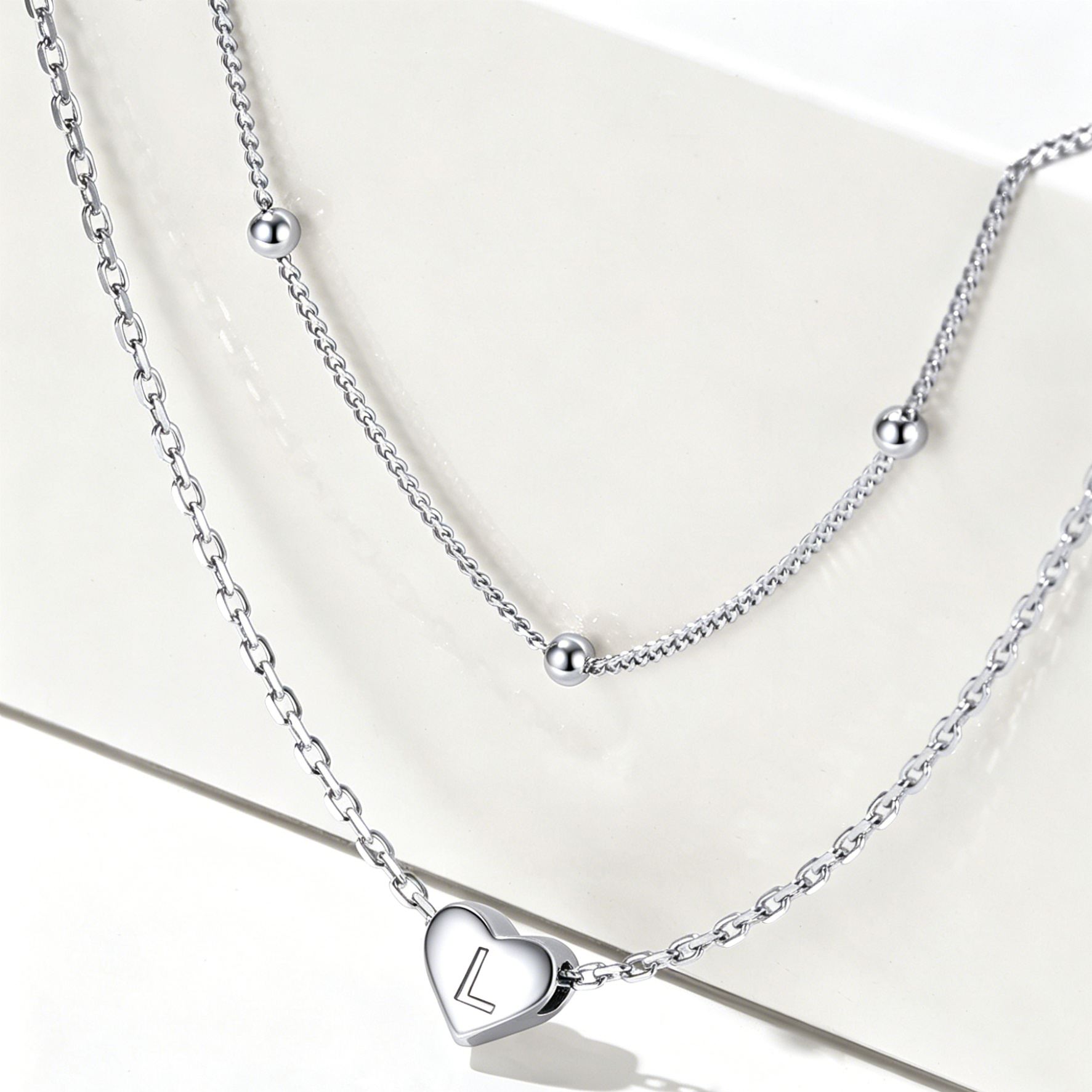 Double-layered initial heart necklace