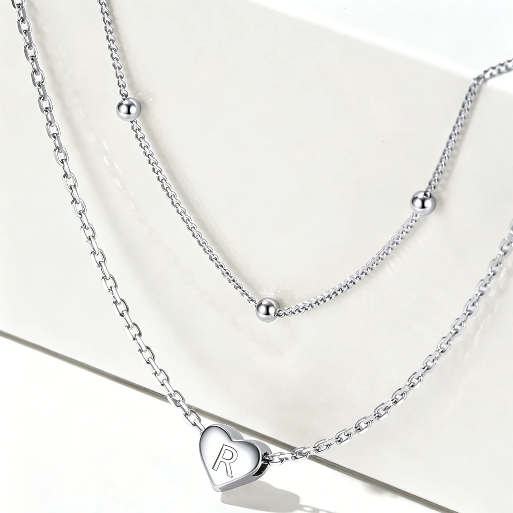 Double-layered initial heart necklace