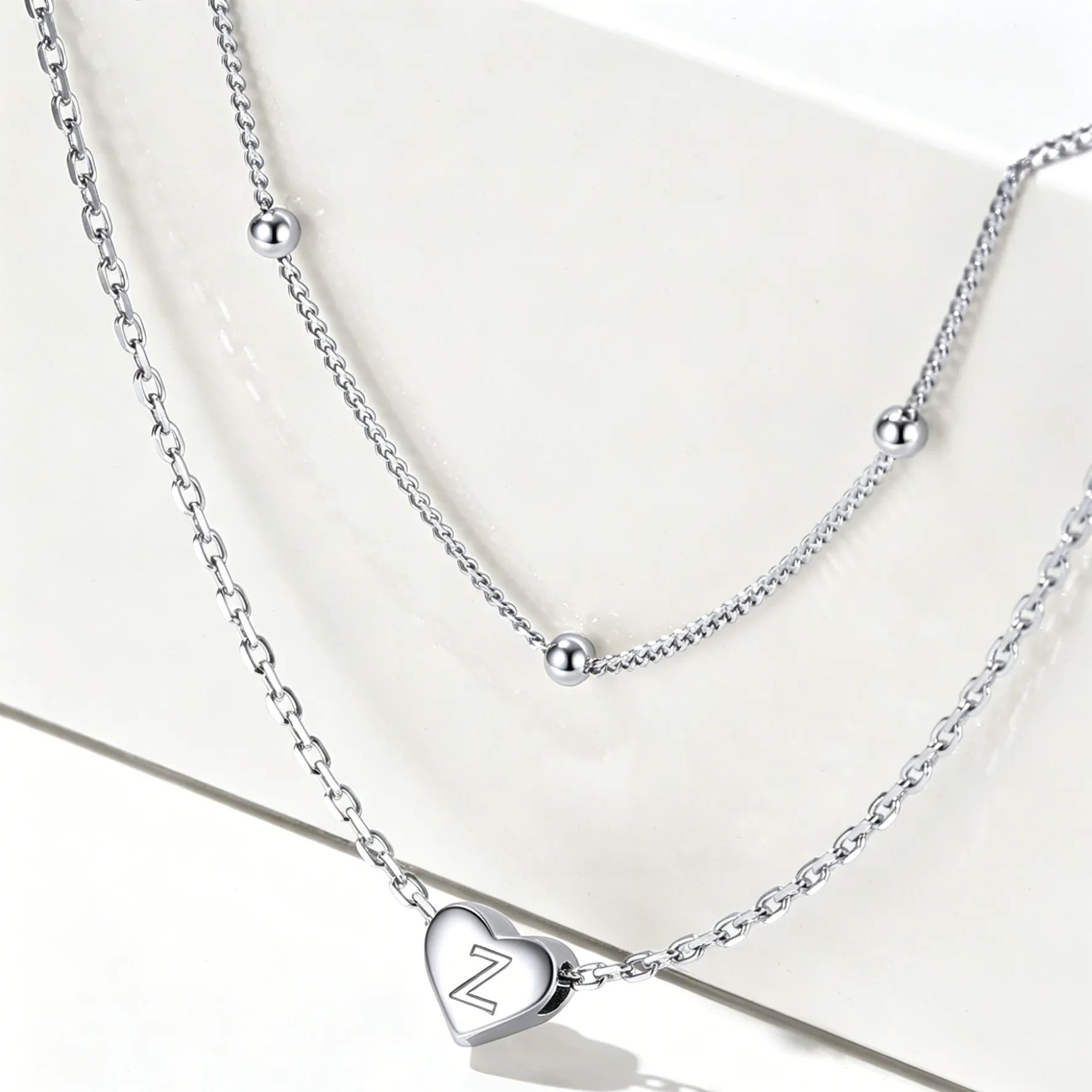 Double-layered initial heart necklace