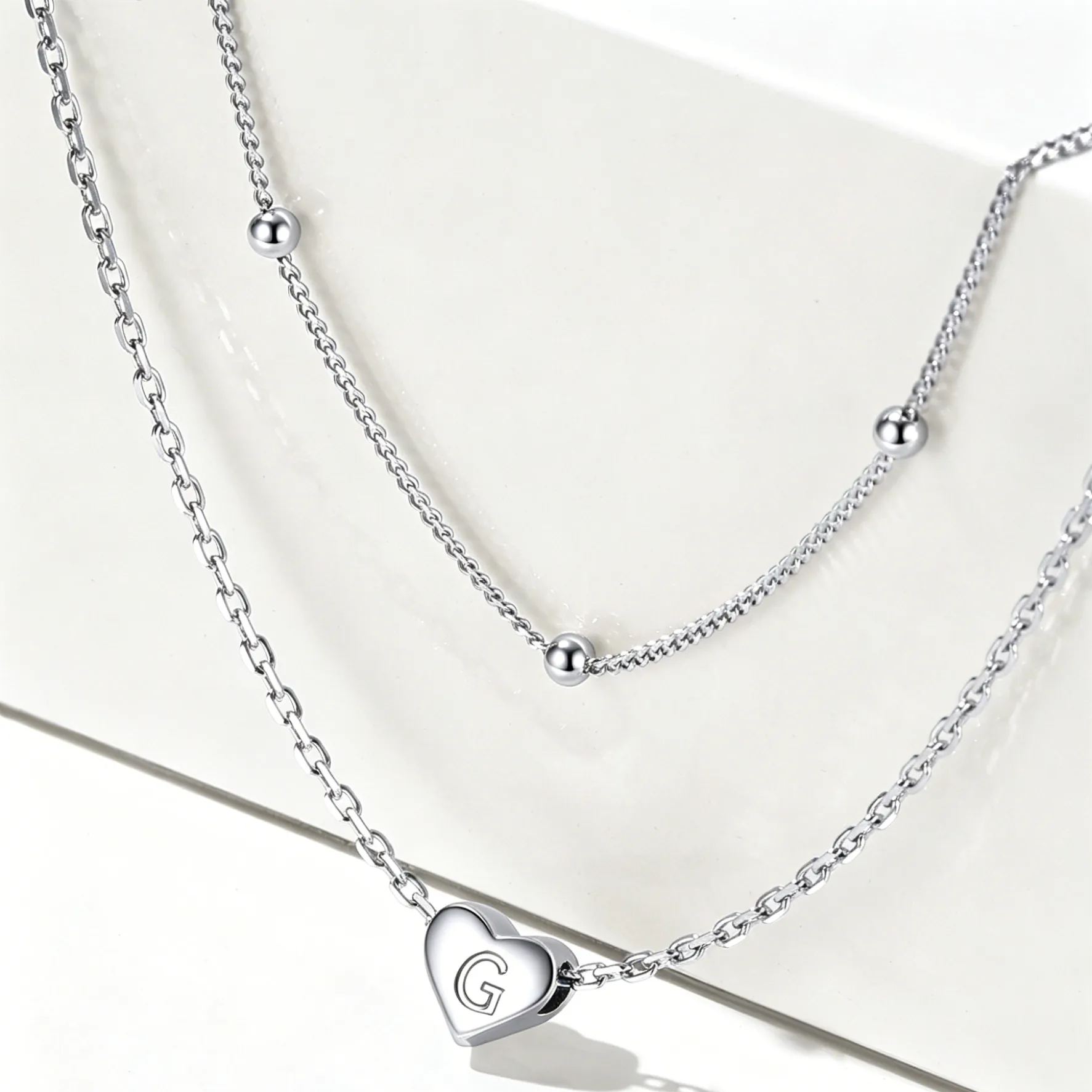 Double-layered initial heart necklace