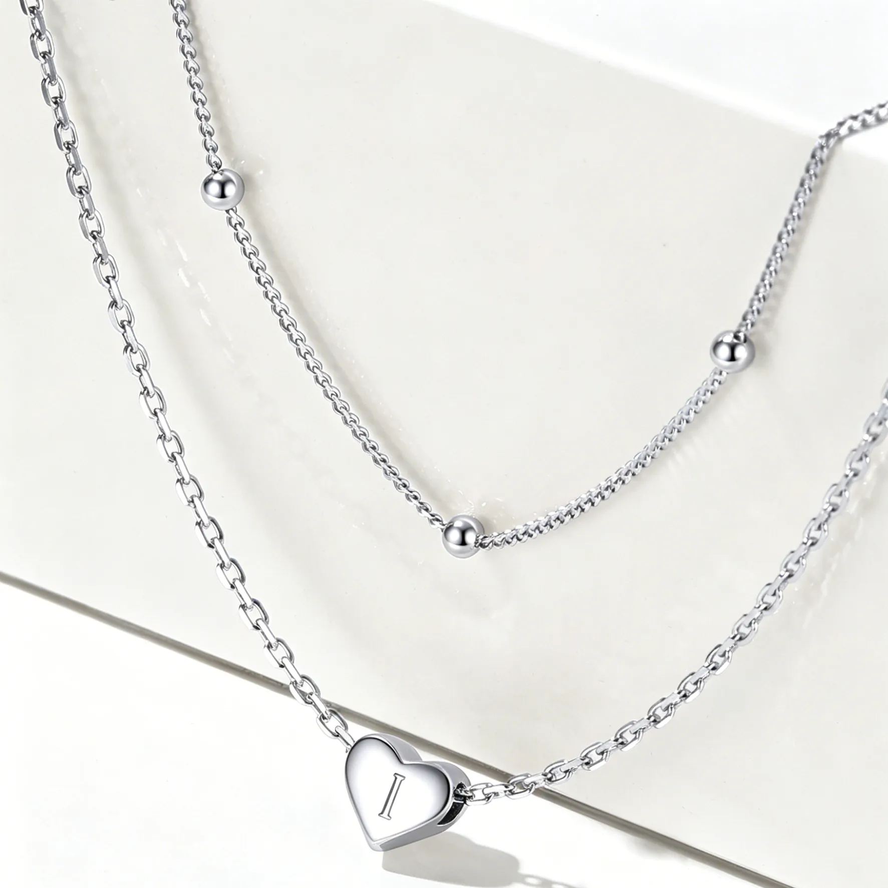 Double-layered initial heart necklace