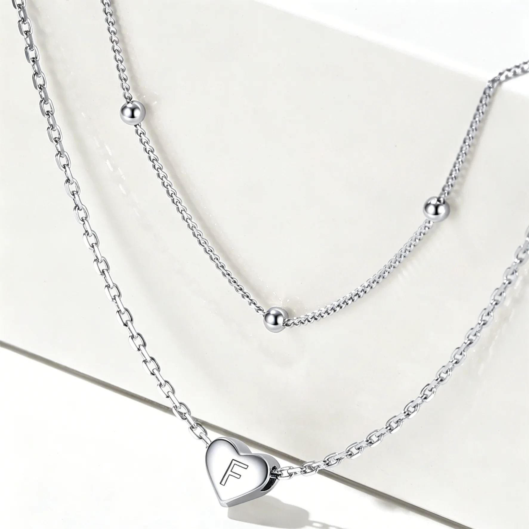 Double-layered initial heart necklace
