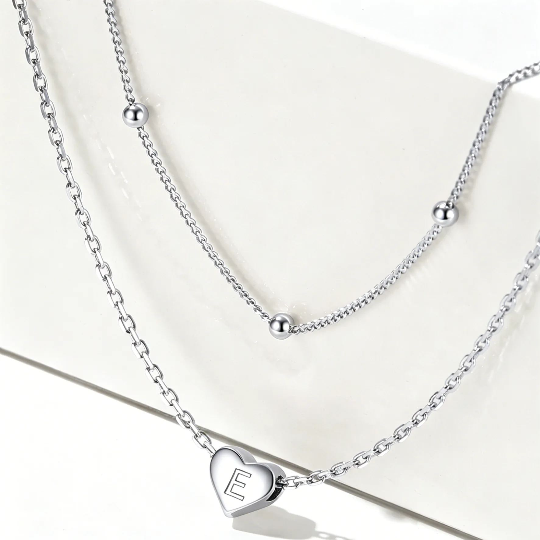 Double-layered initial heart necklace