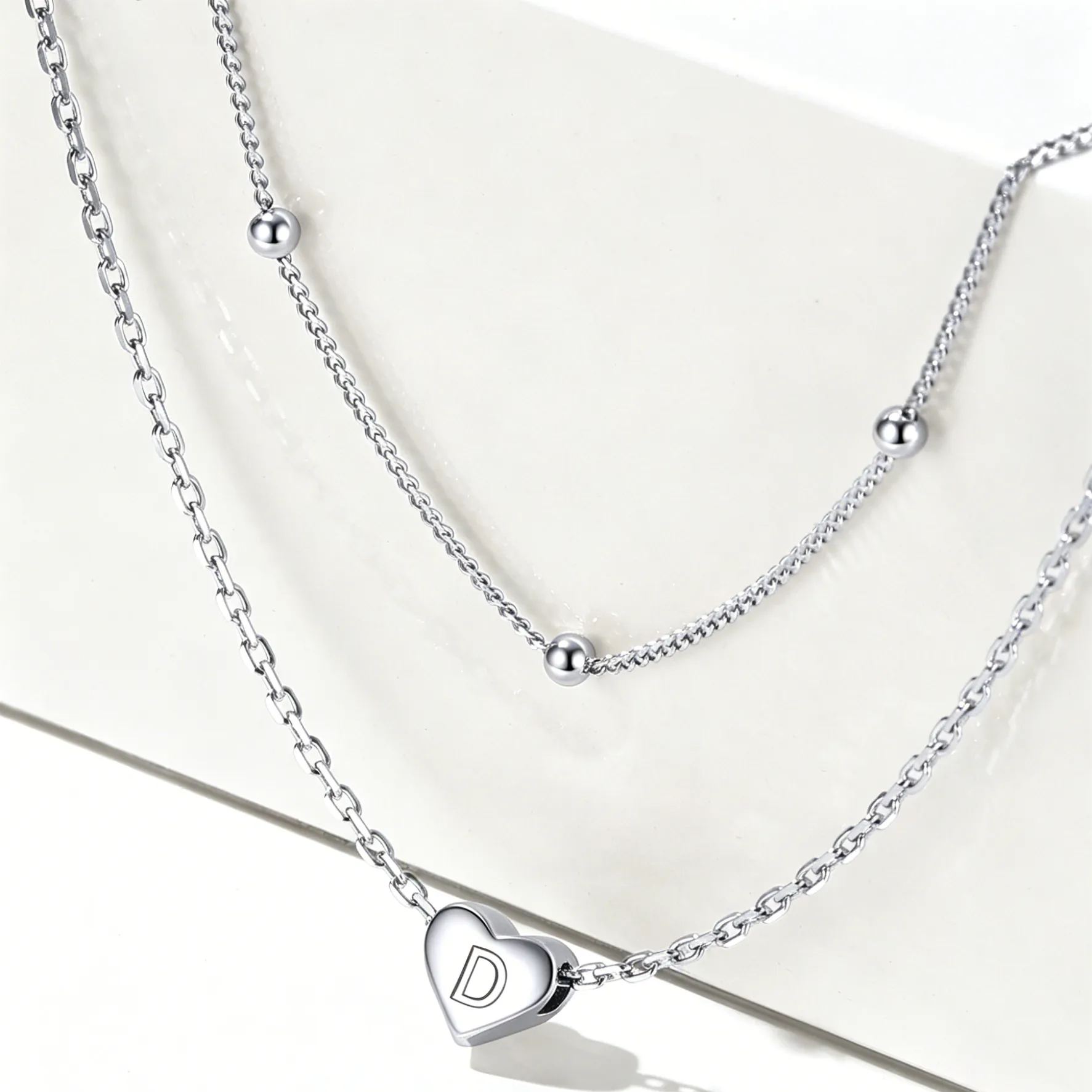 Double-layered initial heart necklace