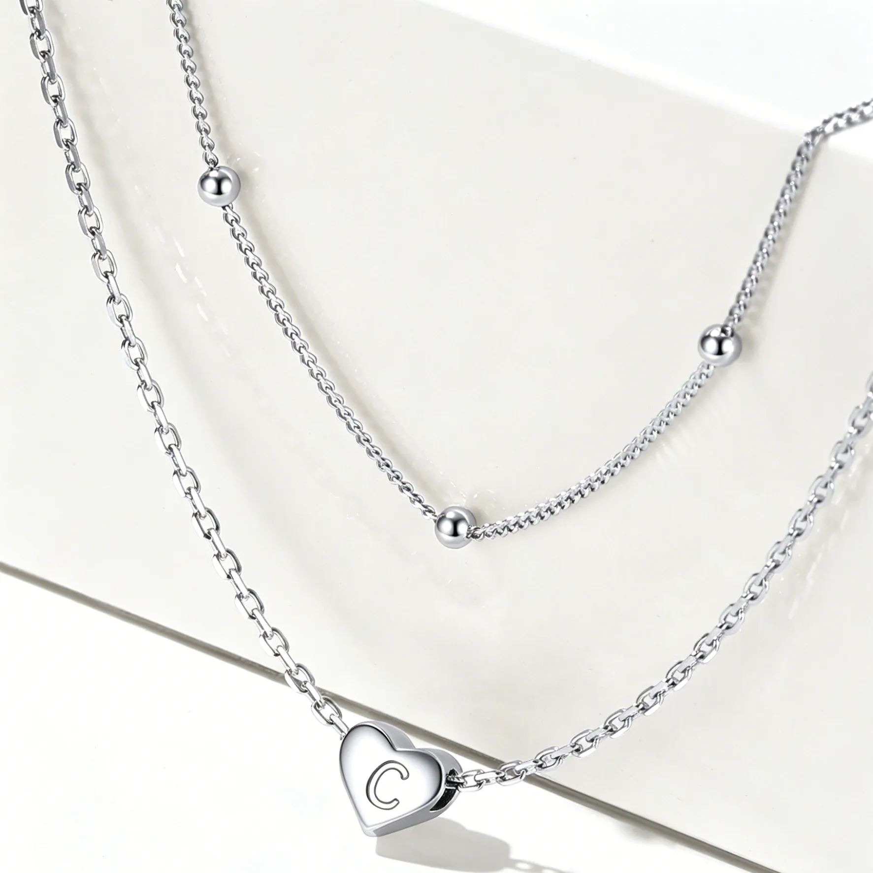 Double-layered initial heart necklace
