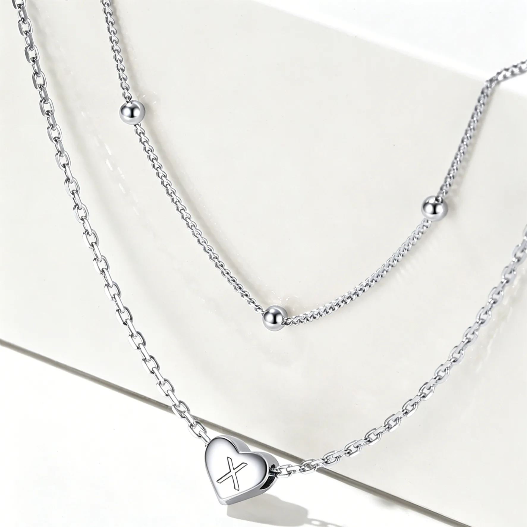 Double-layered initial heart necklace