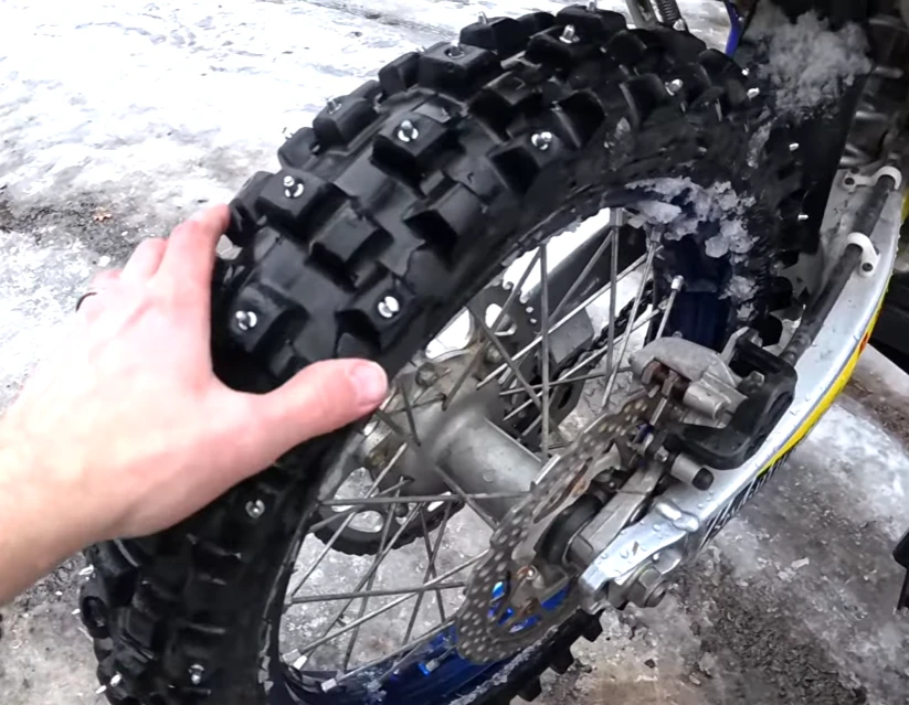 The effect of installing optional anti-skid studs on motorcycle tires.