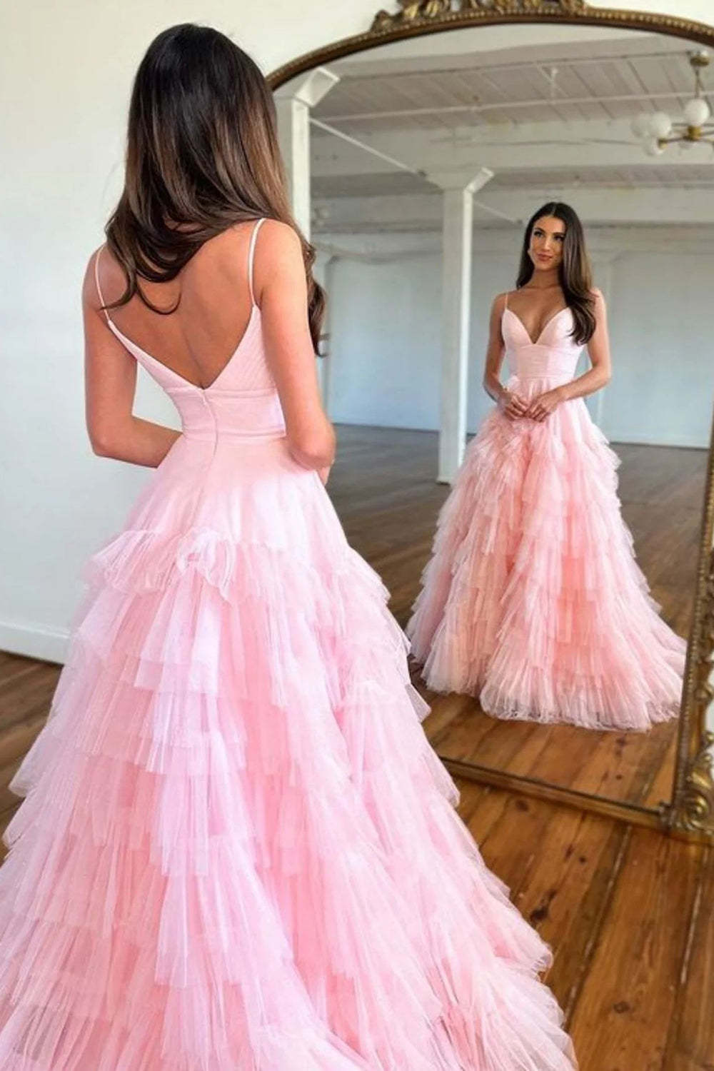 Pink long prom dress with spaghetti straps and ruffles in A-line style
