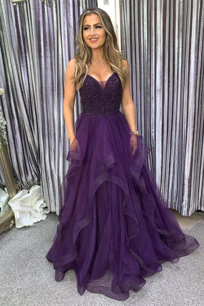 Long Dark Purple Prom Dress with Spaghetti Straps and Beading in an A-Line Cut