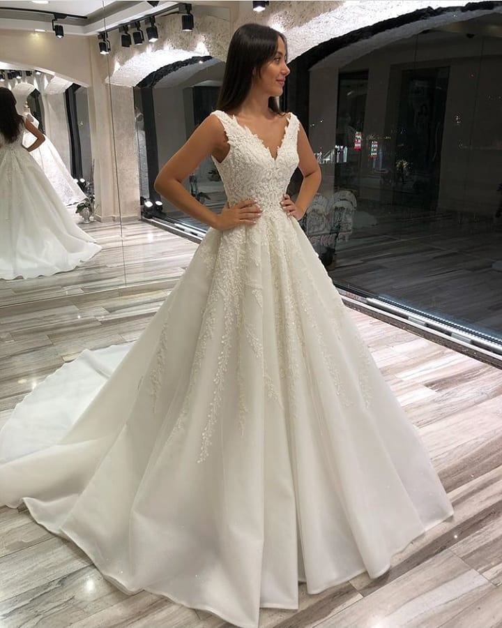 Stunning Sleeveless V-Neck Long A-Line Wedding Dress with Lace