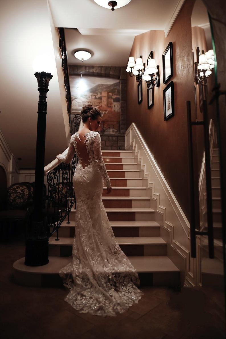 Charming White High Neck Backless Mermaid Long Sleeve Wedding Dress with Appliques Lace
