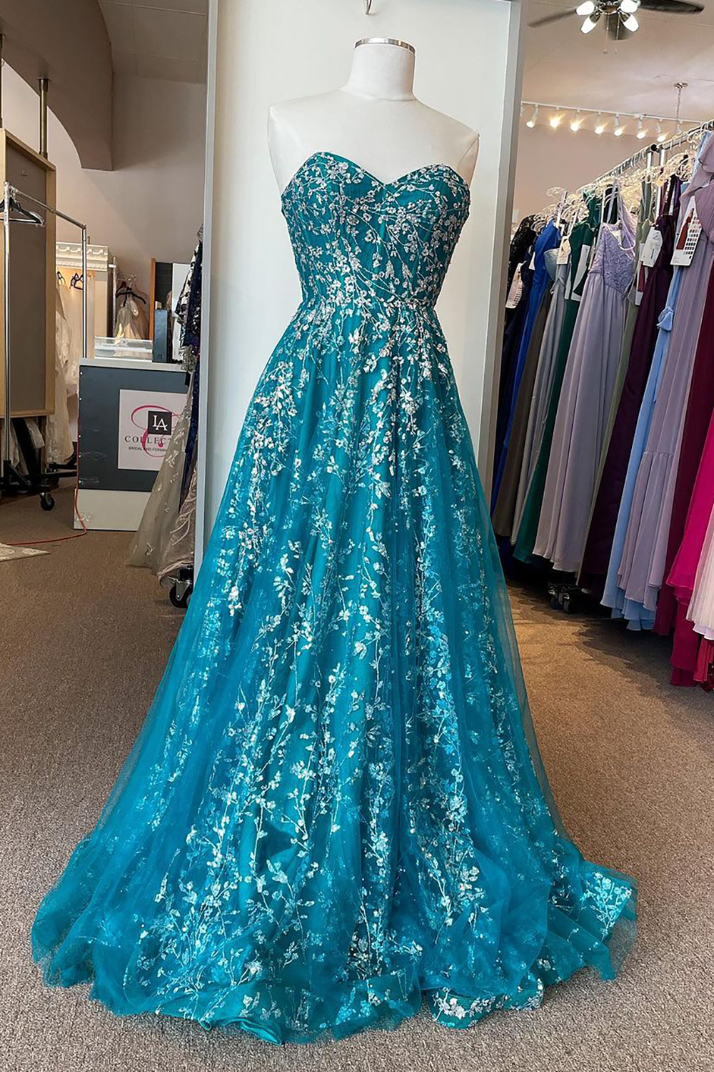Elegant Sweetheart Peacock Blue A-Line Corset Prom Dress Featuring Appliques