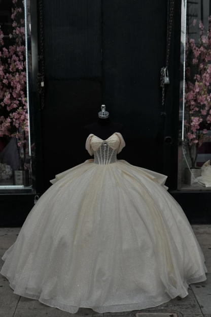 Off-the-Shoulder Apricot Ball Gown with Sparkly Tulle Ruffles and Bow for Quinceanera